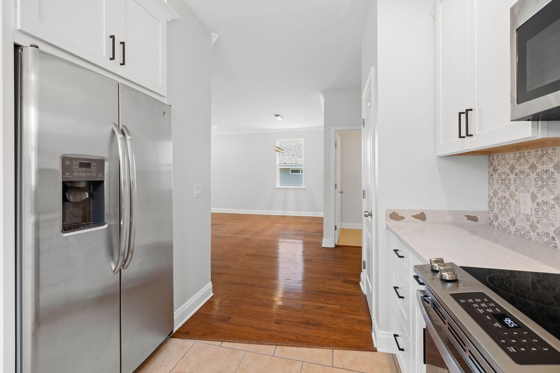 229 County Line Road Niceville, FL 32578 - Photo 8 of 43 a kitchen with stainless steel appliances granite countertop a refrigerator and a stove