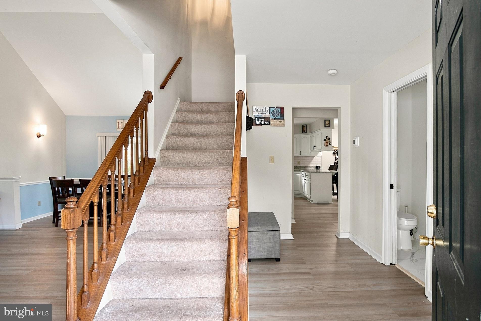 Half bath is convenient to the left of entrance