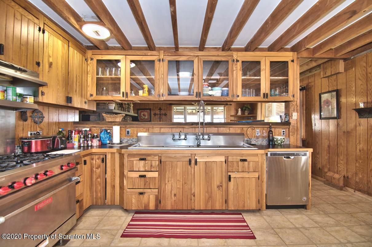 293 State Rte 1002 Tunkhannock, PA 18657 - Photo 11 of 71 a kitchen with stainless steel appliances granite countertop a sink and cabinets