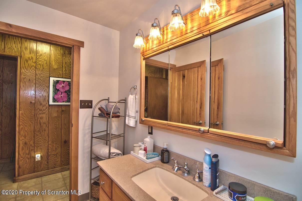 293 State Rte 1002 Tunkhannock, PA 18657 - Photo 20 of 71 a bathroom with a sink vanity and a mirror