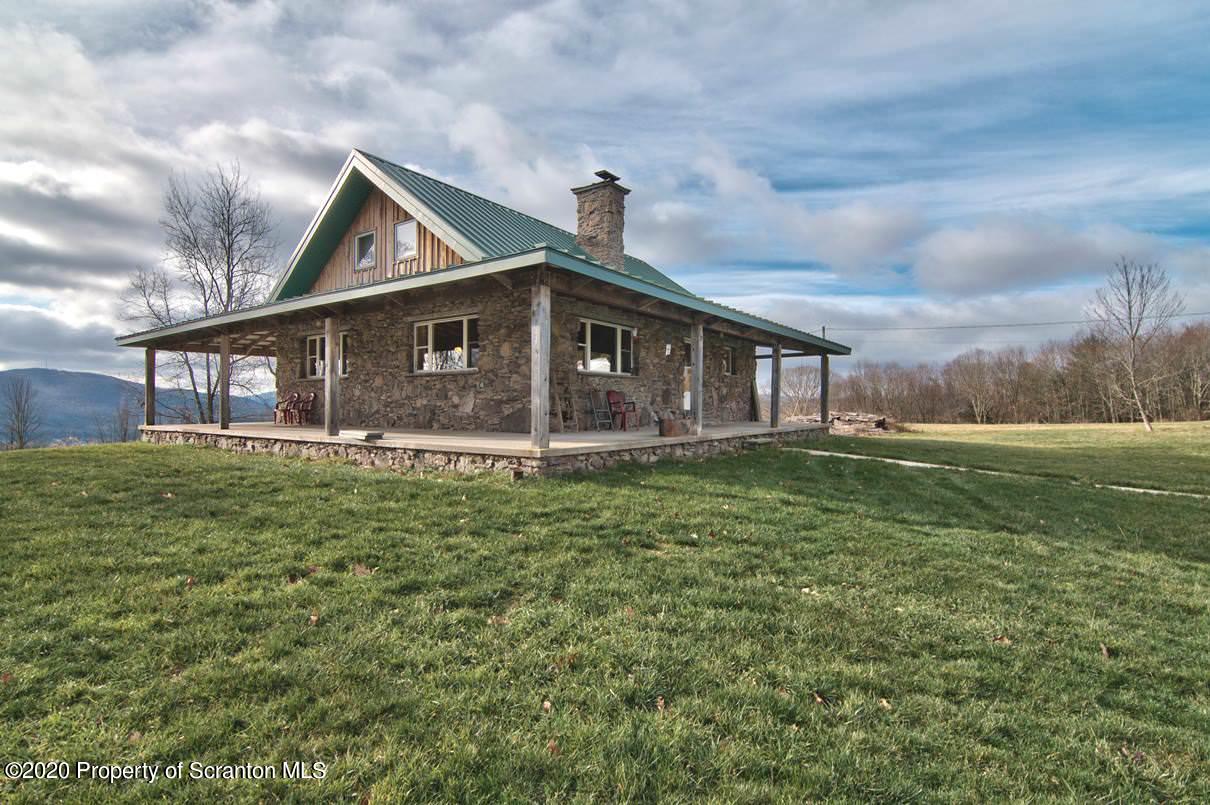 293 State Rte 1002 Tunkhannock, PA 18657 - Photo 2 of 71 a front view of a house with a yard