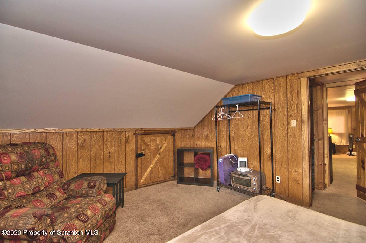 293 State Rte 1002 Tunkhannock, PA 18657 - Photo 30 of 71 a bedroom with furniture and a window