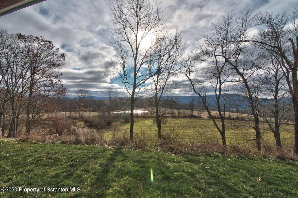 293 State Rte 1002 Tunkhannock, PA 18657 - Photo 40 of 71 a backyard of a house with lots of green space