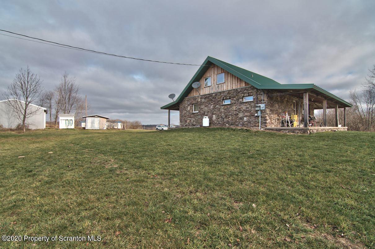 293 State Rte 1002 Tunkhannock, PA 18657 - Photo 44 of 71 a view of a house with a big yard and large trees