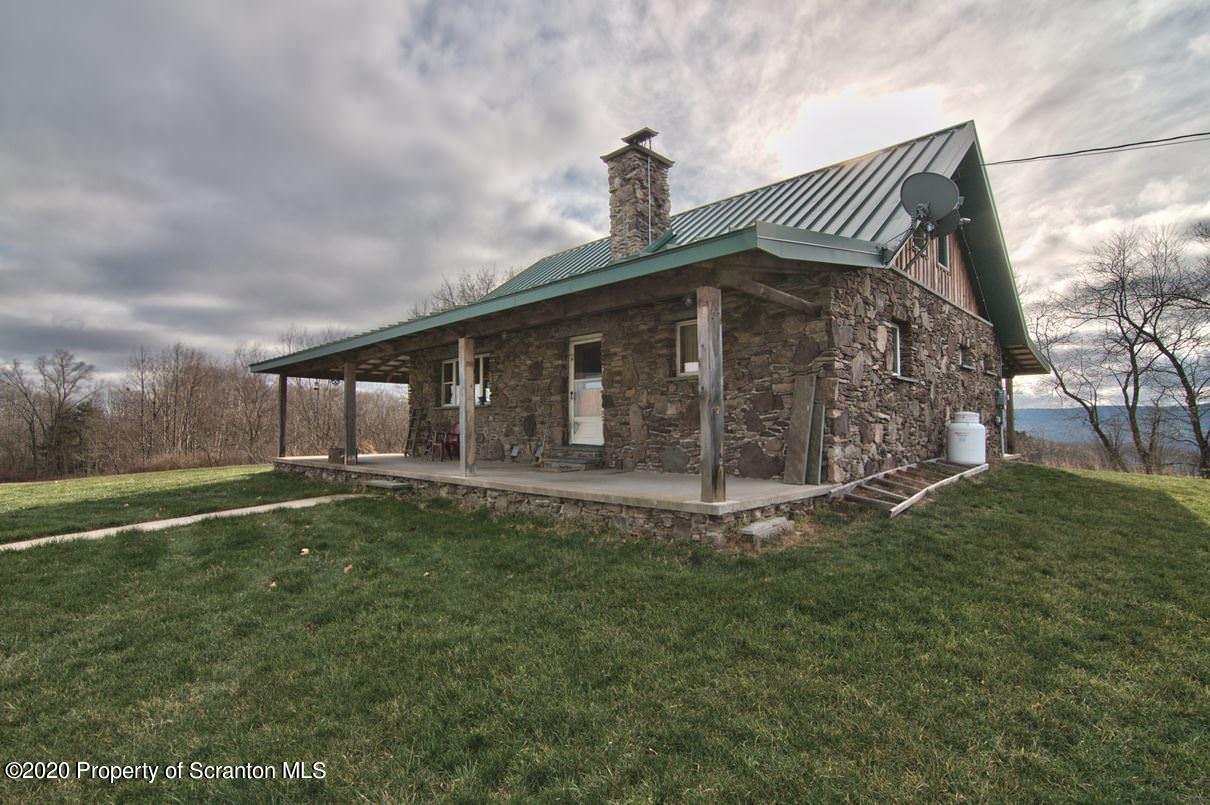 293 State Rte 1002 Tunkhannock, PA 18657 - Photo 48 of 71 a front view of a house with garden
