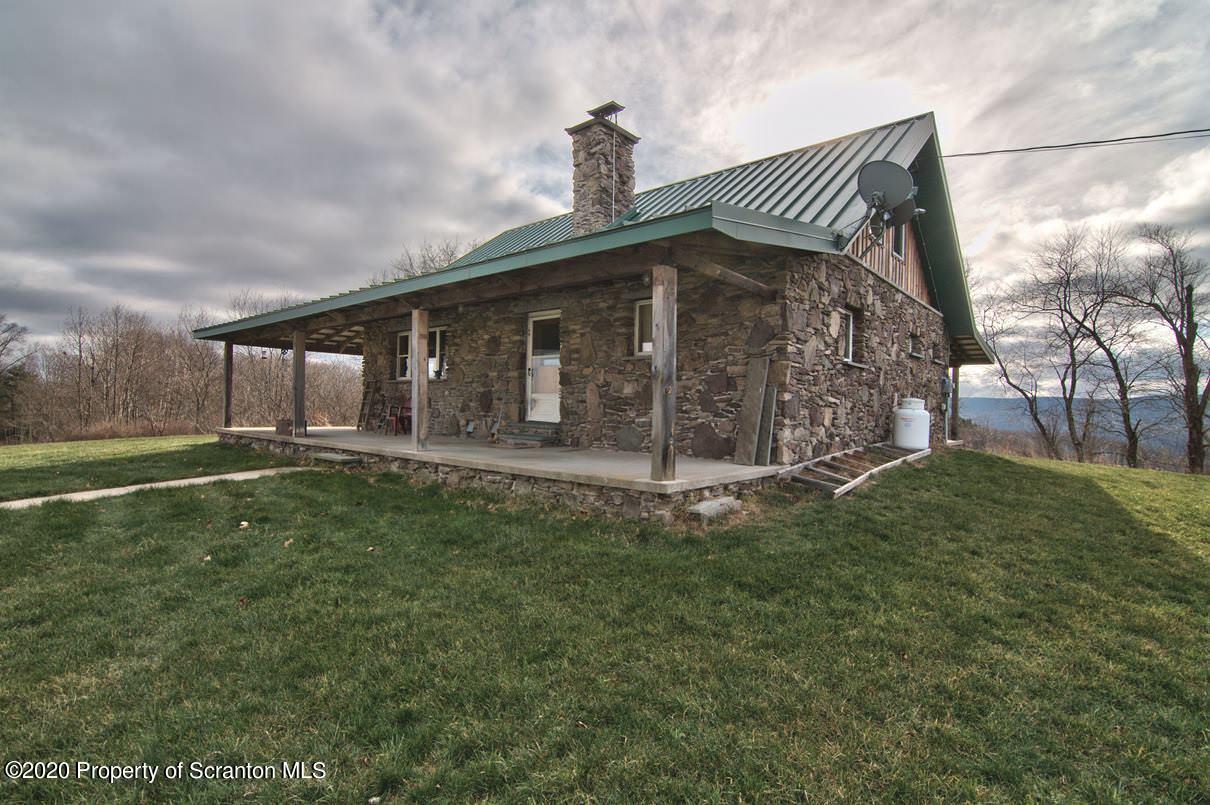 293 State Rte 1002 Tunkhannock, PA 18657 - Photo 49 of 71 a front view of a house with garden