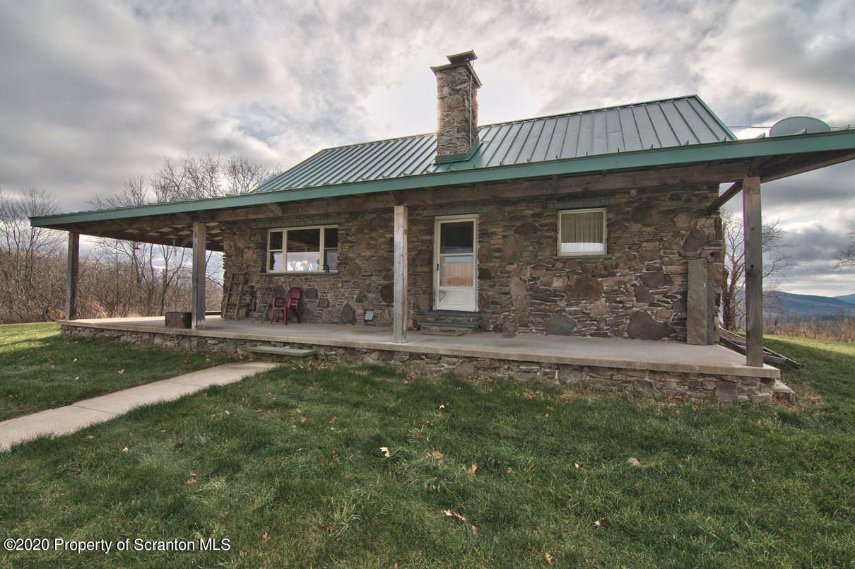 293 State Rte 1002 Tunkhannock, PA 18657 - Photo 50 of 71 a front view of a house with a garden