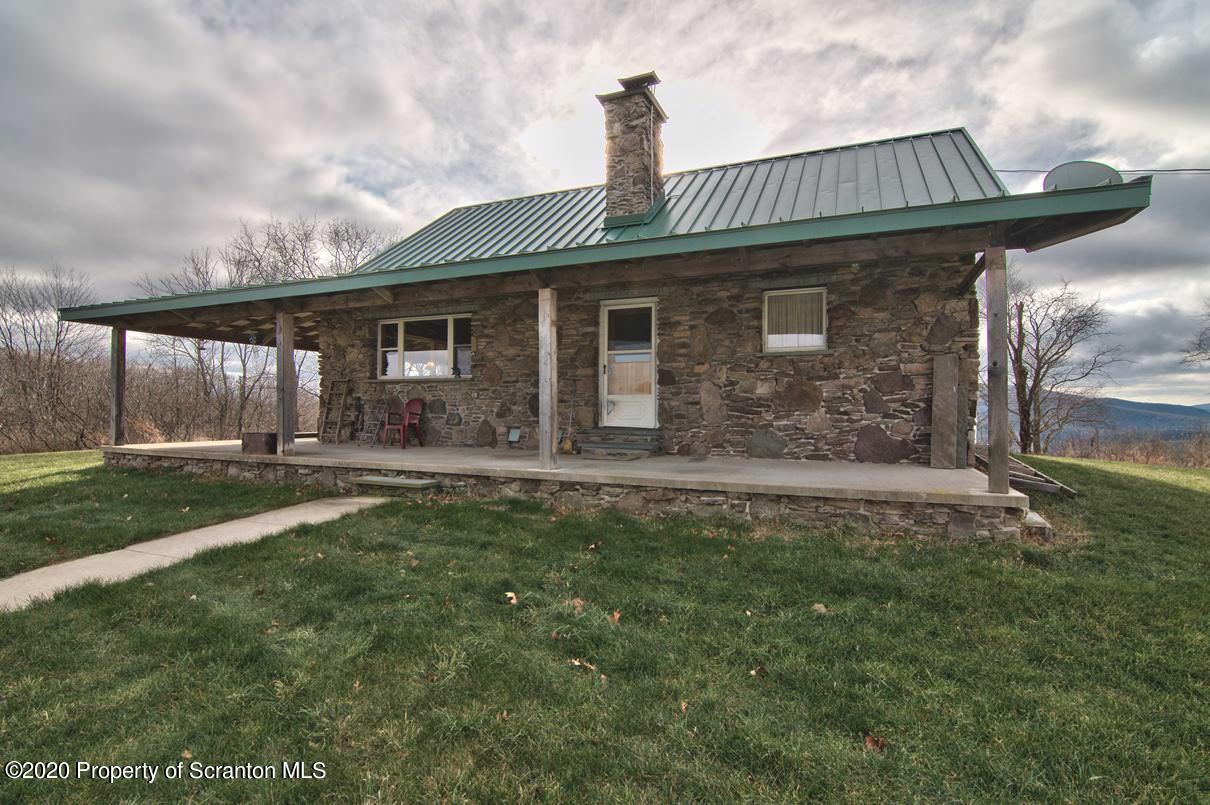 293 State Rte 1002 Tunkhannock, PA 18657 - Photo 51 of 71 a front view of a house with garden
