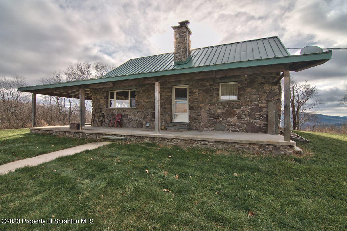 293 State Rte 1002 Tunkhannock, PA 18657 - Photo 52 of 71 a front view of a house with garden