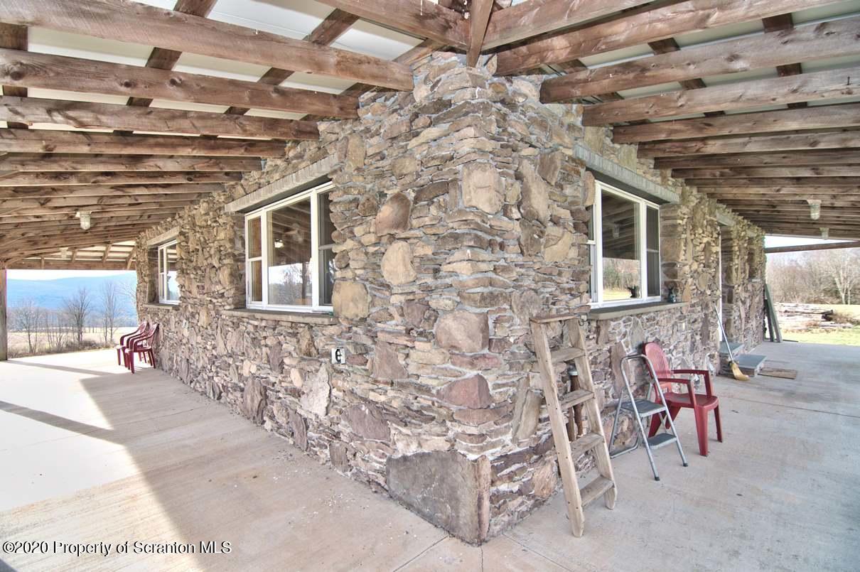 293 State Rte 1002 Tunkhannock, PA 18657 - Photo 54 of 71 a view of a porch with a table and chairs
