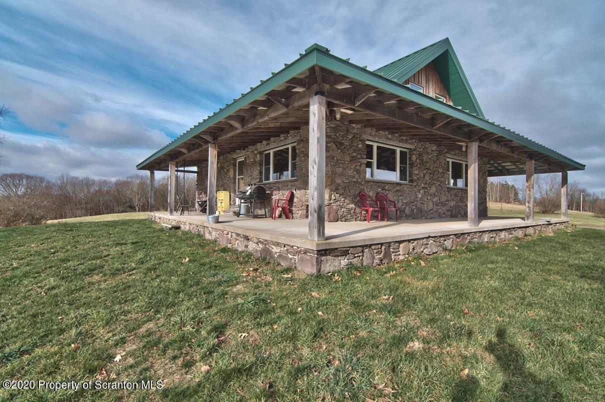 293 State Rte 1002 Tunkhannock, PA 18657 - Photo 57 of 71 a backyard of a house with table and chairs