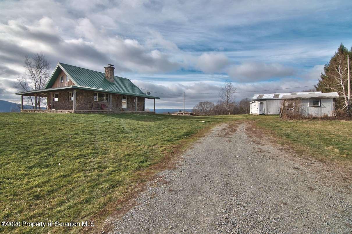 293 State Rte 1002 Tunkhannock, PA 18657 - Photo 65 of 71 a view of a large house with a big yard and large trees