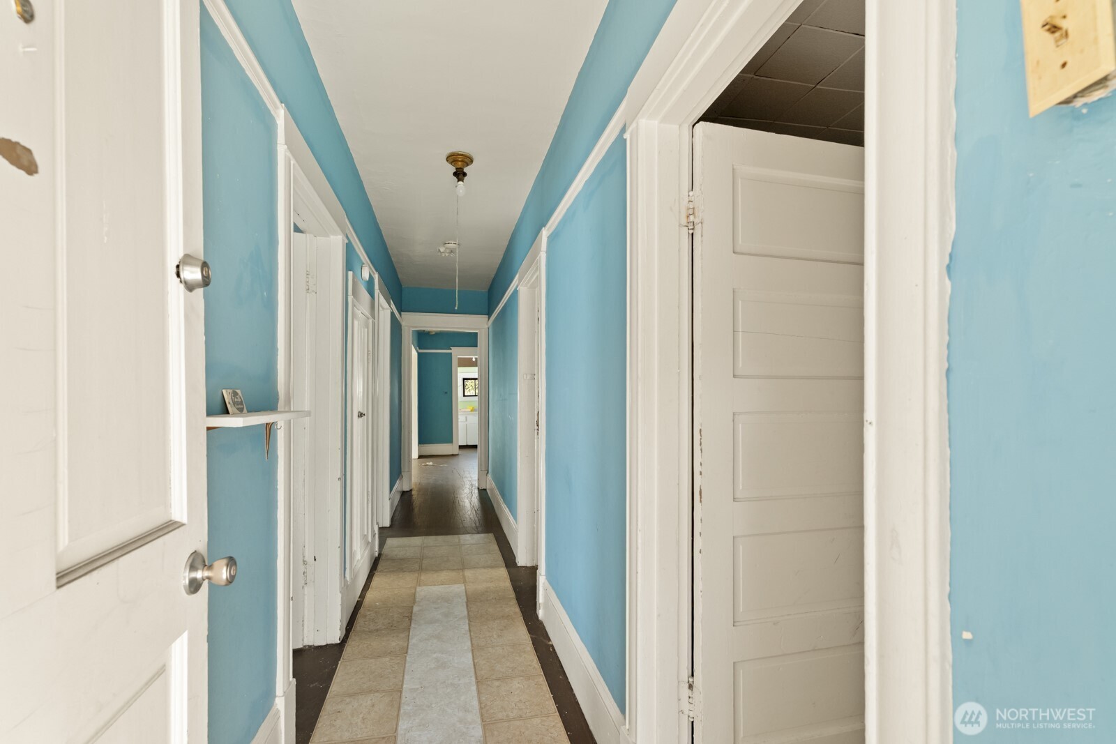 4812 46th Avenue Southwest Seattle, WA 98116 - Photo 12 of 26 a view of a hallway with wooden floors