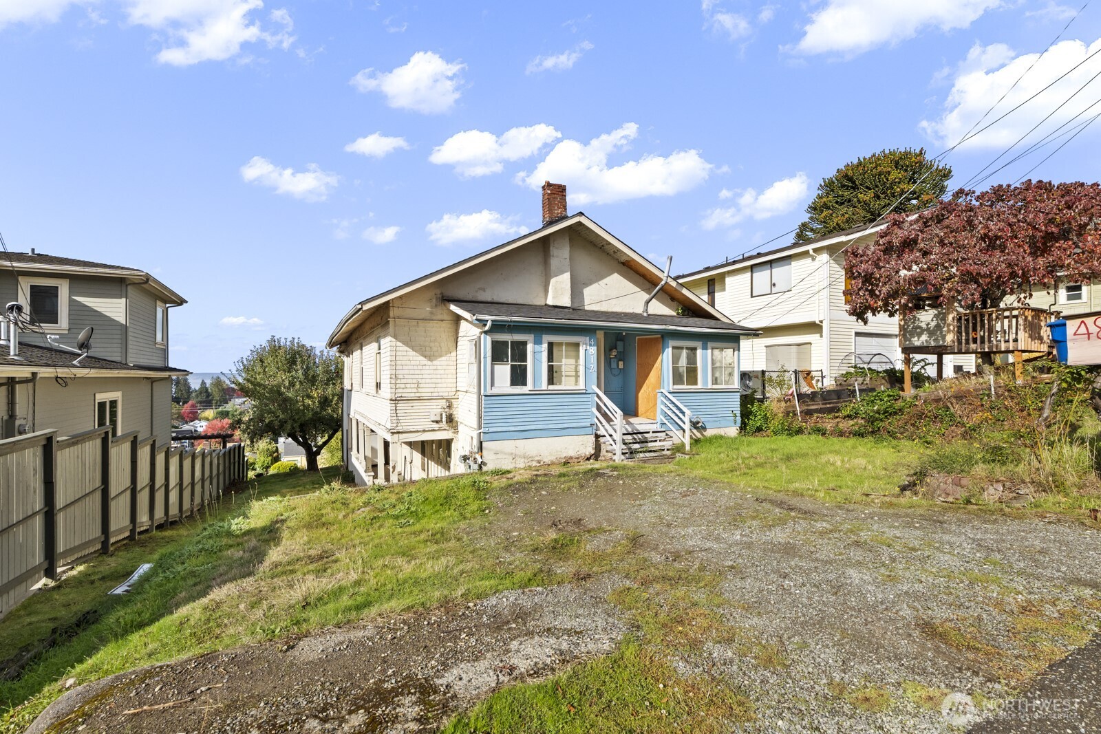 4812 46th Avenue Southwest Seattle, WA 98116 - Photo 6 of 26 a view of a house with a yard