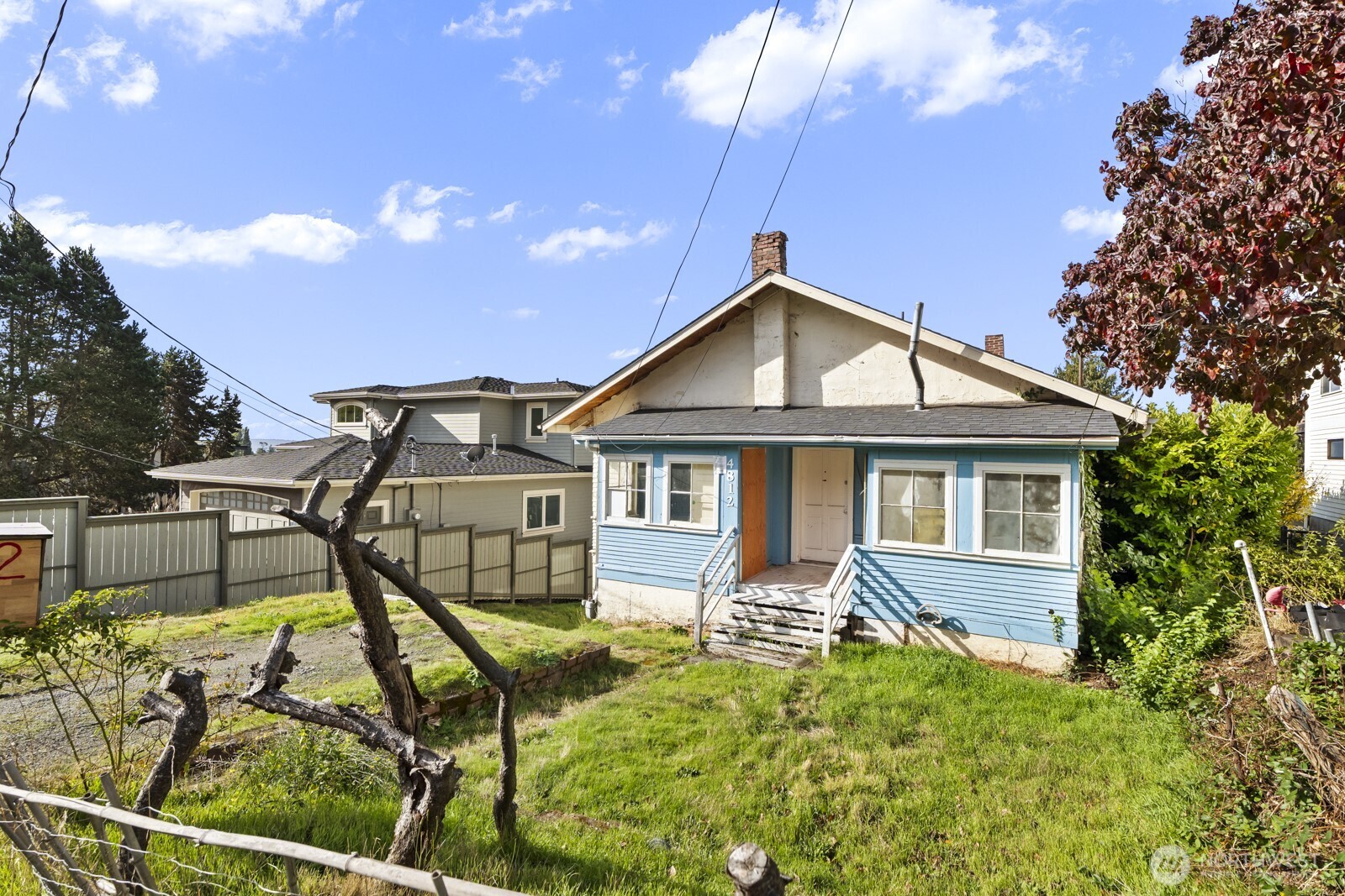 4812 46th Avenue Southwest Seattle, WA 98116 - Photo 7 of 26 a front view of a house with entertaining space