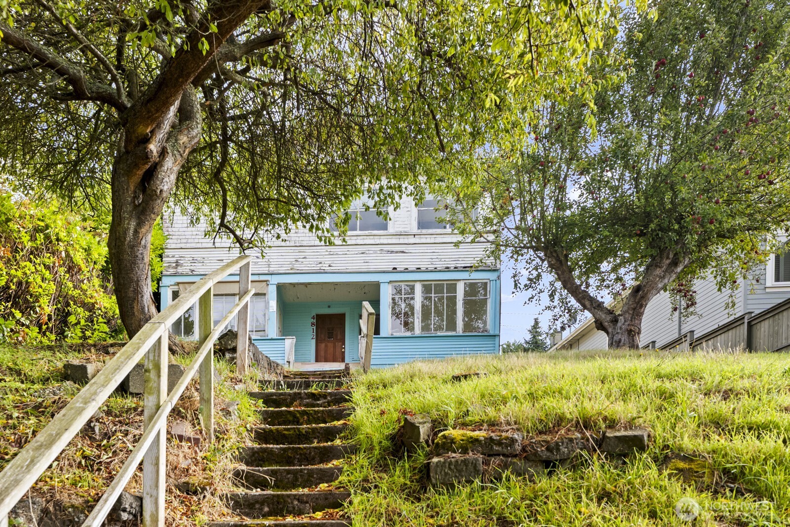 4812 46th Avenue Southwest Seattle, WA 98116 - Photo 9 of 26 front view of house with a yard