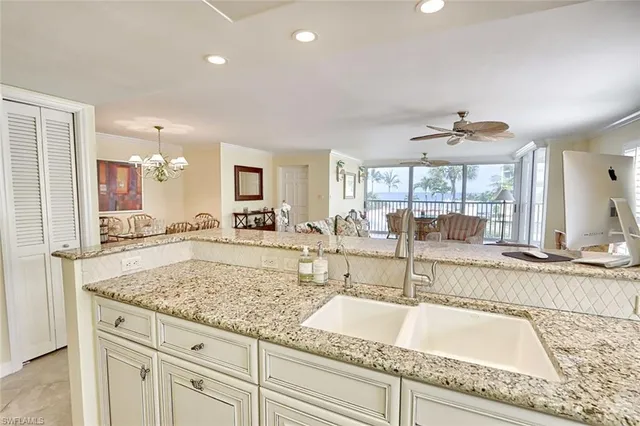 a view of a kitchen counter top space cabinets and center island