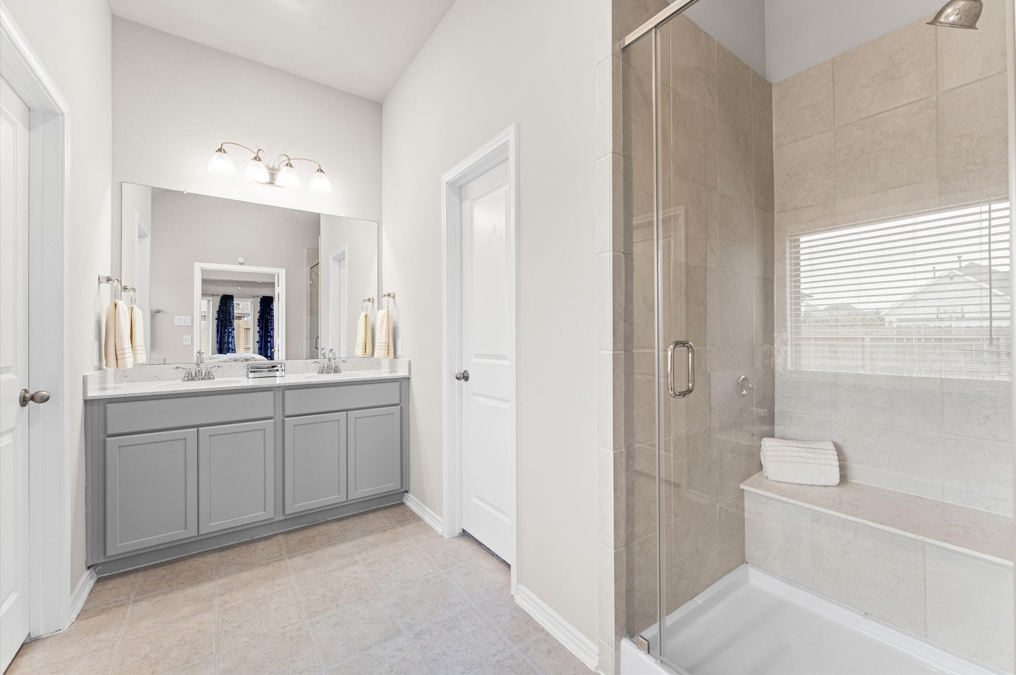 2702 Meadow View Lane Conroe, TX 77385 - Photo 12 of 26 a bathroom with a sink a toilet and mirror
