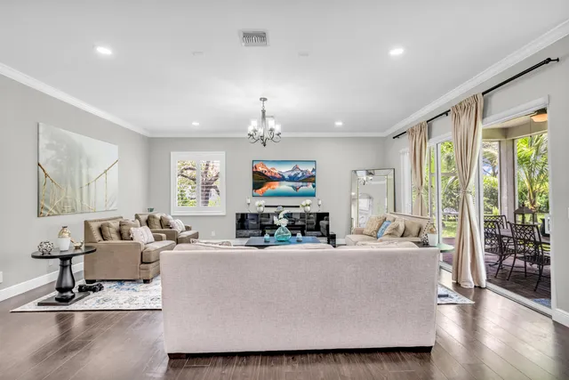 a view of a balcony with wooden floor and outdoor seating