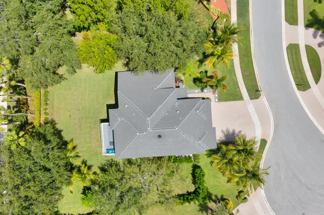 an aerial view of a house with a swimming pool
