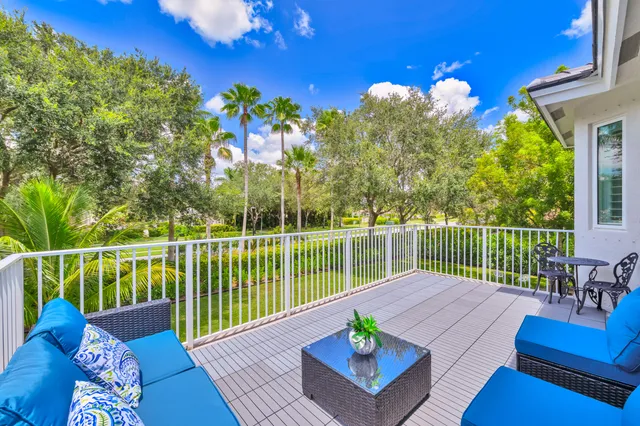 a view of a chairs and table in the garden
