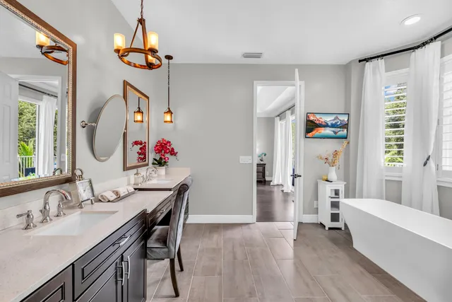 an aerial view of a house with a yard basket ball court and outdoor seating