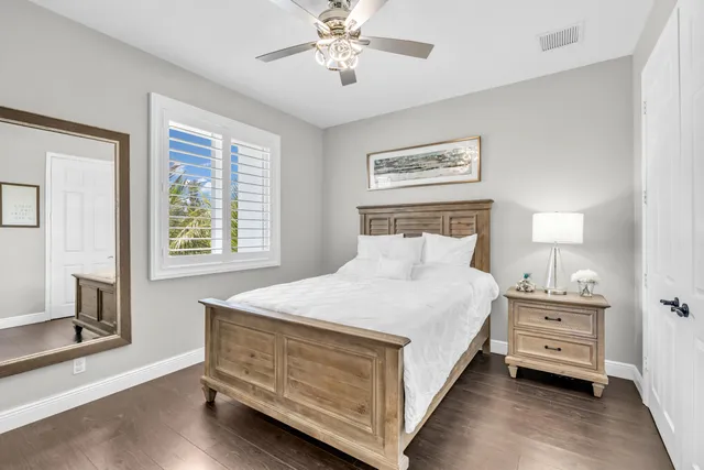 an aerial view of lake and residential houses with outdoor space
