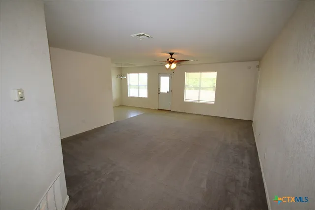 an empty room that has a window