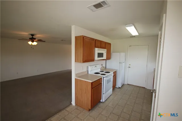 a bathroom with a sink a mirror and a toilet