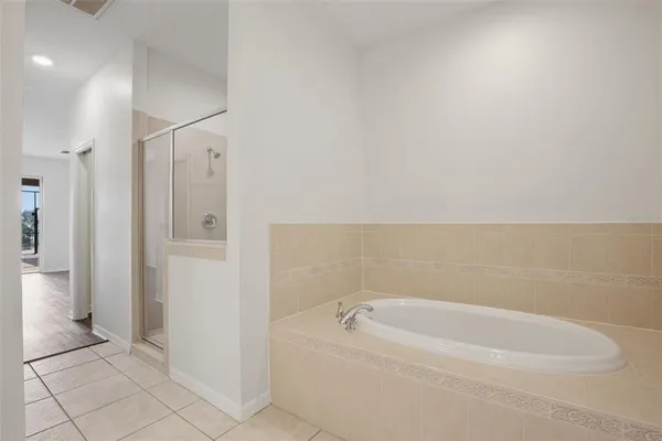 a bathroom with a bathtub and shower