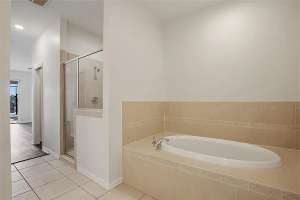 a bathroom with a bathtub and a shower