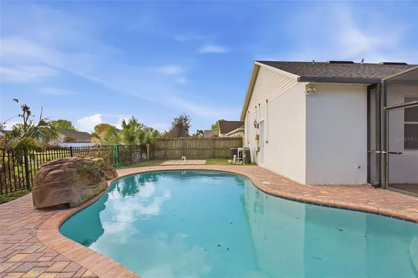 a swimming pool with an outdoor seating