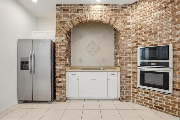 a view of a kitchen with a fireplace