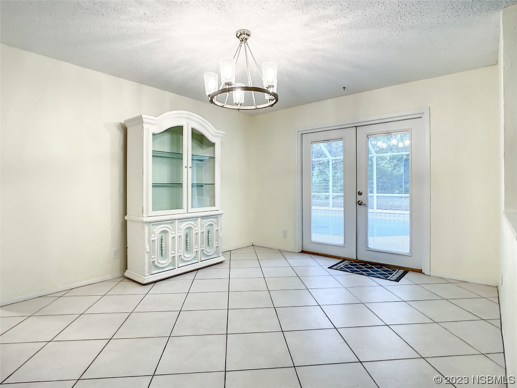 865 North Ridgewood Avenue Ormond Beach, FL 32174 - Photo 14 of 32 a view of an empty room with a window