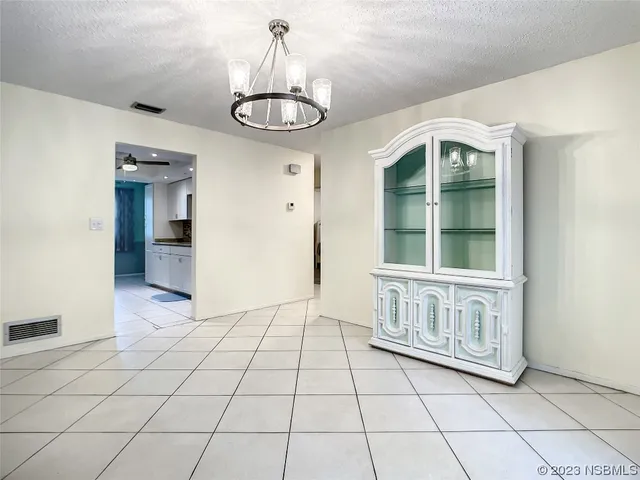 a kitchen with stainless steel appliances granite countertop a stove microwave and refrigerator