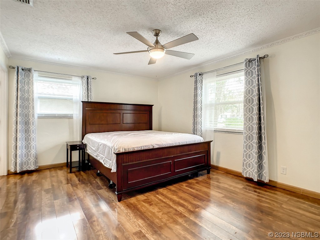 865 North Ridgewood Avenue Ormond Beach, FL 32174 - Photo 21 of 32 a bedroom with a bed and window