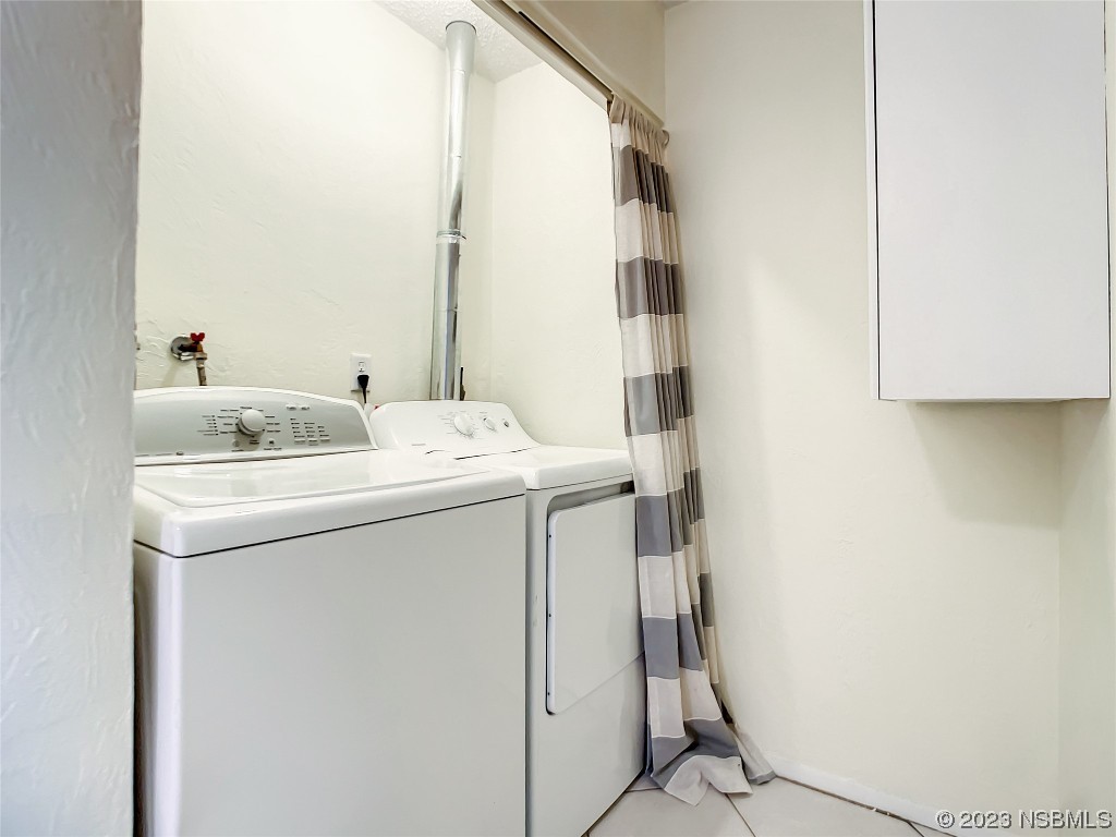 865 North Ridgewood Avenue Ormond Beach, FL 32174 - Photo 23 of 32 a utility room with dryer and washer