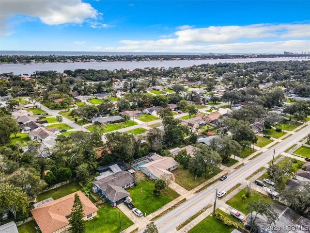 an aerial view of residential houses with outdoor space