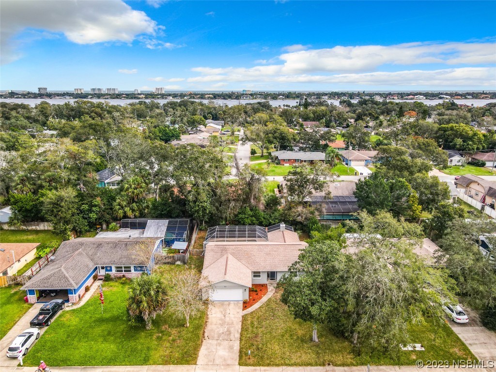 865 North Ridgewood Avenue Ormond Beach, FL 32174 - Photo 31 of 32 an aerial view of residential houses with outdoor space