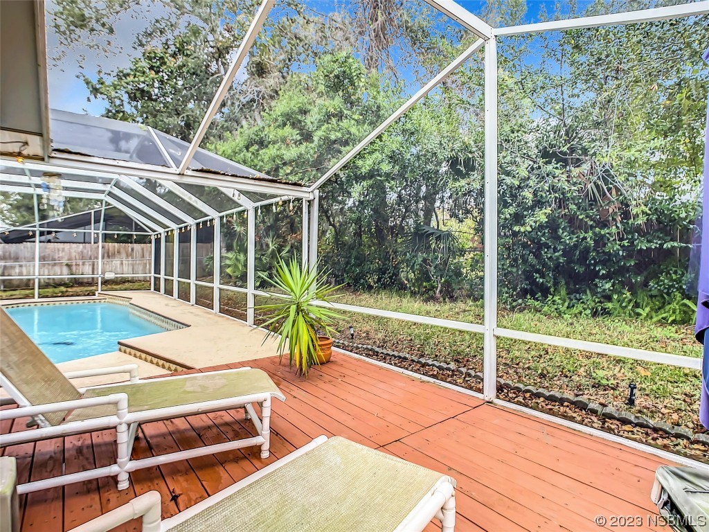 865 North Ridgewood Avenue Ormond Beach, FL 32174 - Photo 7 of 32 a view of a house with a backyard