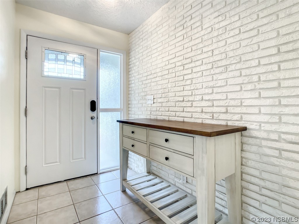 865 North Ridgewood Avenue Ormond Beach, FL 32174 - Photo 8 of 32 a bathroom with a sink and a mirror