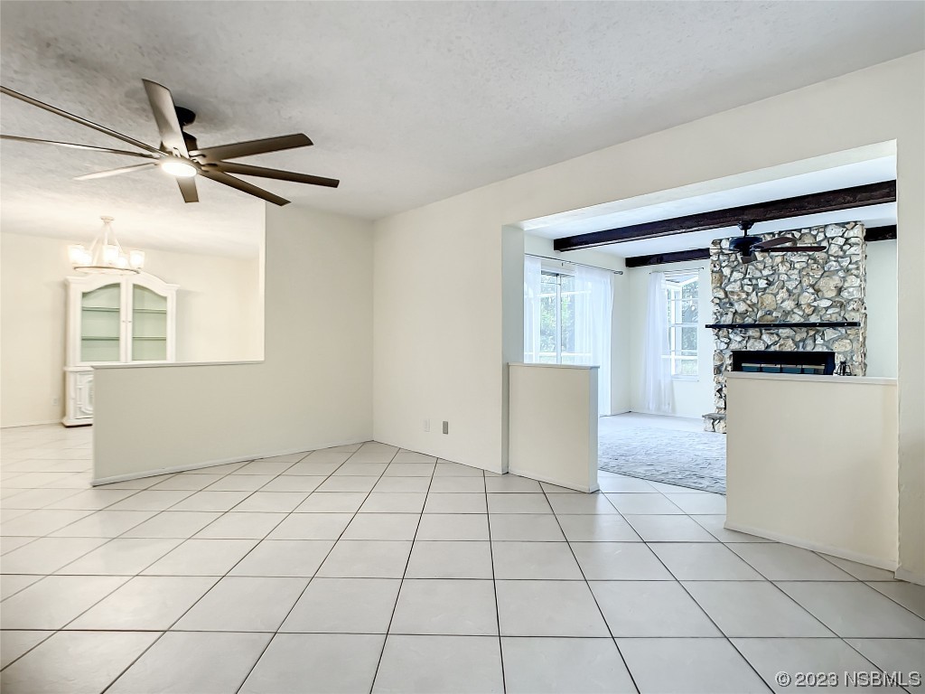 865 North Ridgewood Avenue Ormond Beach, FL 32174 - Photo 9 of 32 a view of a livingroom with wooden floor and a refrigerator