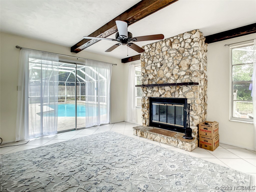 865 North Ridgewood Avenue Ormond Beach, FL 32174 - Photo 10 of 32 a view of empty room with fireplace and fan