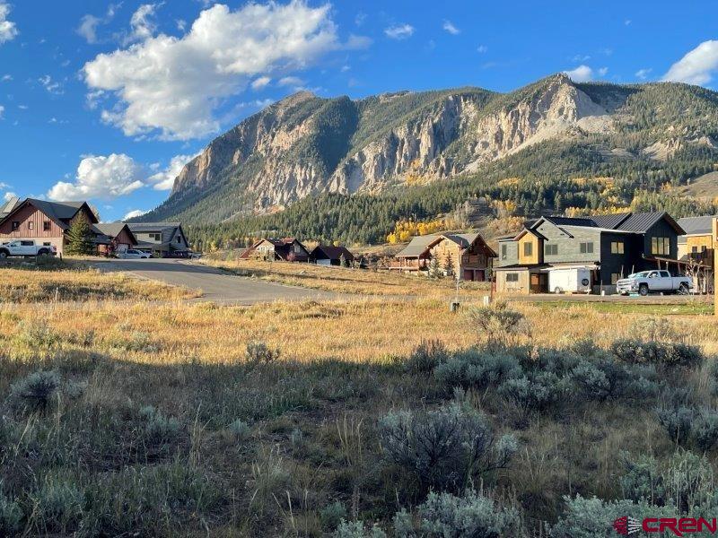 84 Chestnut Lane Crested Butte, CO 81224 - Photo 1 of 28 a view of a building with a big yard