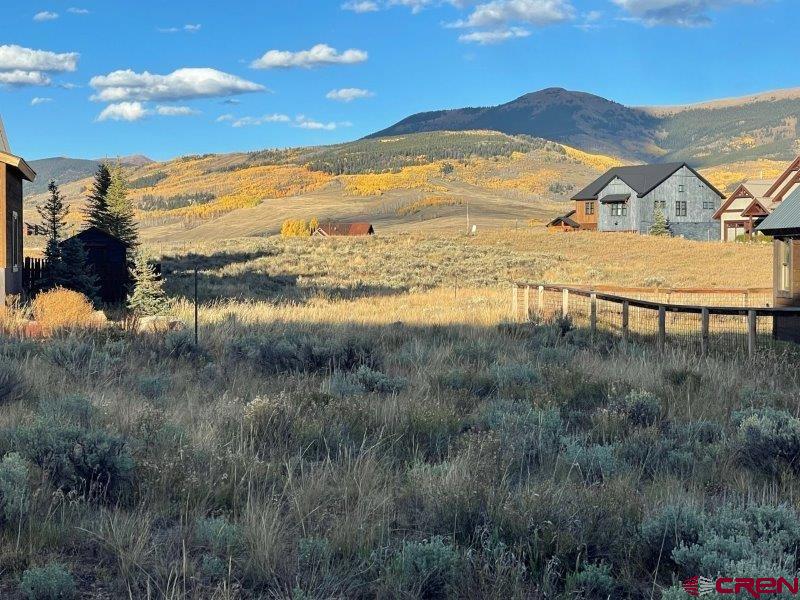 84 Chestnut Lane Crested Butte, CO 81224 - Photo 2 of 28 a view of a lake with a mountain in the background