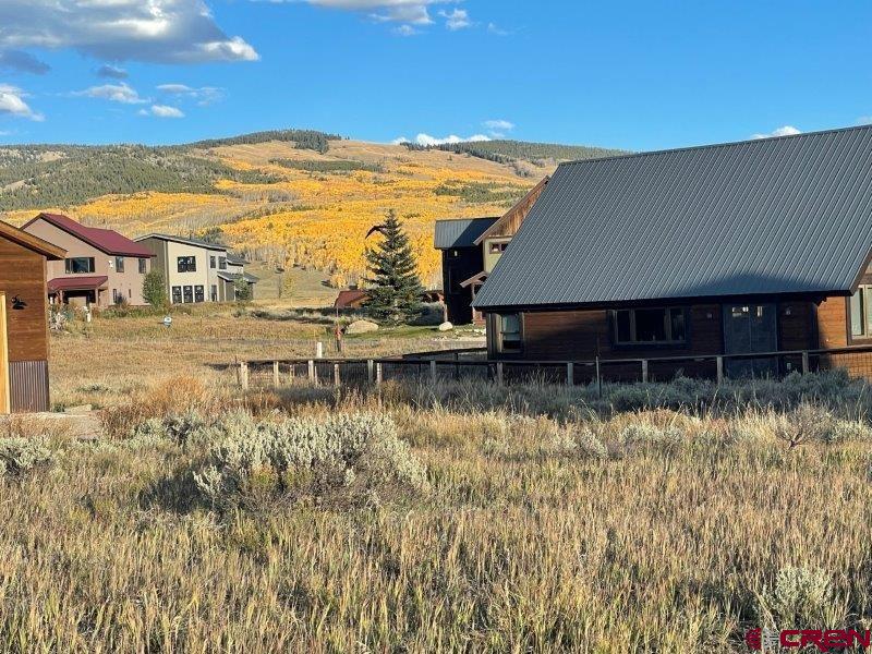 84 Chestnut Lane Crested Butte, CO 81224 - Photo 3 of 28 a view of a house with a yard