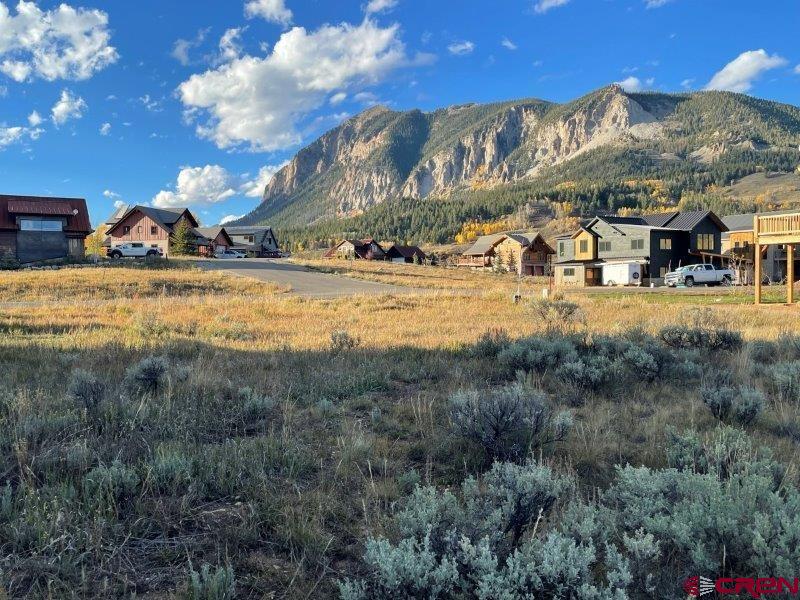 84 Chestnut Lane Crested Butte, CO 81224 - Photo 9 of 28 a view of a town with mountains & house in the background