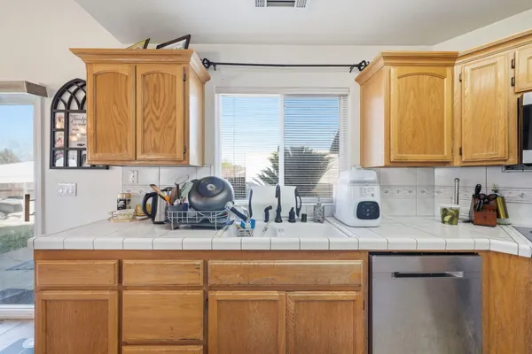 a close view of sink and cabinets