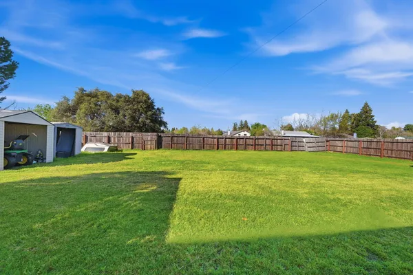 a view of a house with a big yard