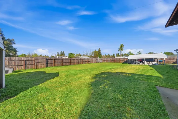 a view of a house with a big yard